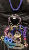 A selection of purple beaded costume jewellery.