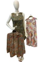 Two vintage dresses and a vintage shirt with no buttons. 1 dress in greens with paisley design and