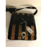 Vintage black and Tan snakeskin shoulder bag. Two interior segments, separated by zip pockets.