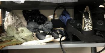 A shelf of bags, scarves and shoes