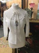 An original true vintage Frill & Bow fronted top.