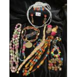 A quantity of multi coloured costume jewellery