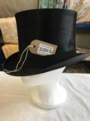 A Lincoln Bennett & Co silk top hat. Size 56.5cm
