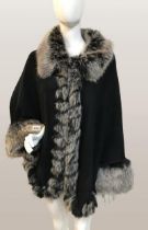 Sioni designed knitted cape with faux Fur from trim size S/M