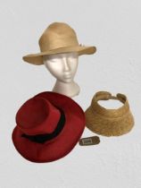 Two vintage straw hats and modern straw sun visor