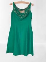A Vintage 1970's A-line Cocktail dress. Bright green with Jewelled neckline size 10-12