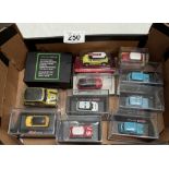 A collection of mostly 1/87 scale classic Mini cars including Shuco