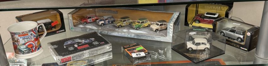 A quantity of Mini models by Cararama, Vitesse etc and Mini collectable cards and a mug