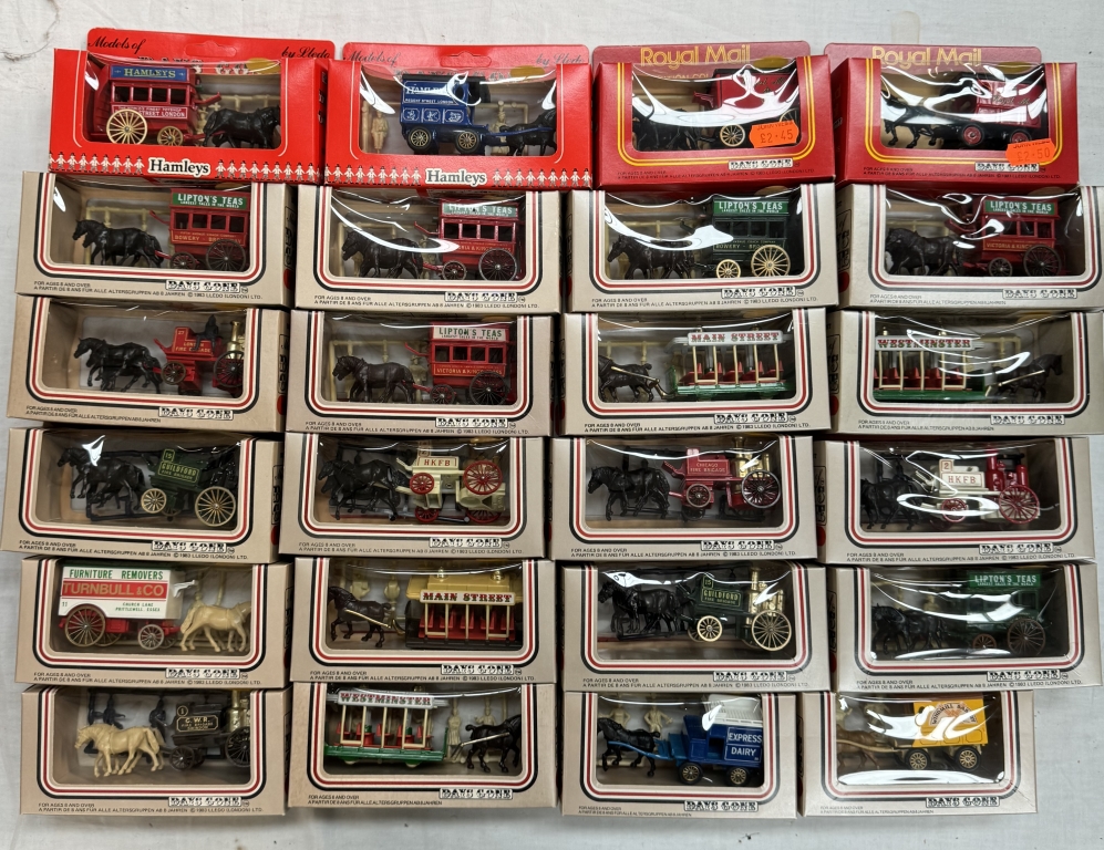 A large box of Lledo horse drawn vehicles