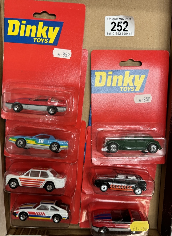 7 Matchbox Dinky toys on blister cards