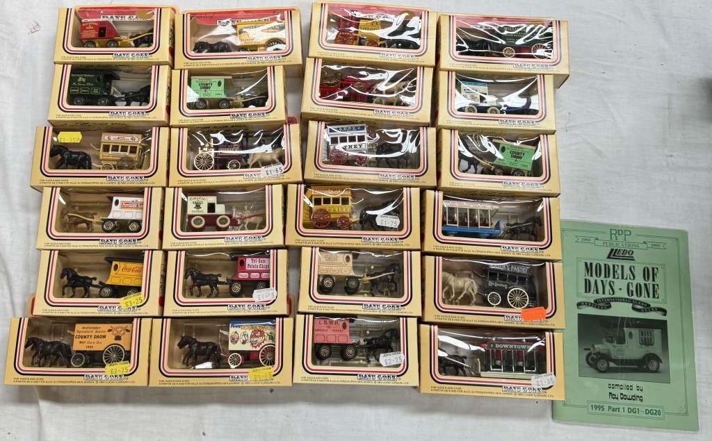 A large box of Lledo horse drawn vehicles