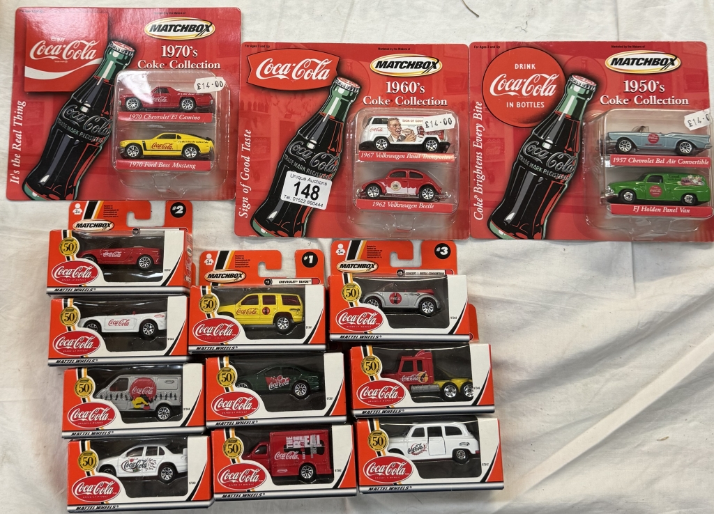 A quantity of Matchbox Coca-Cola collectors models