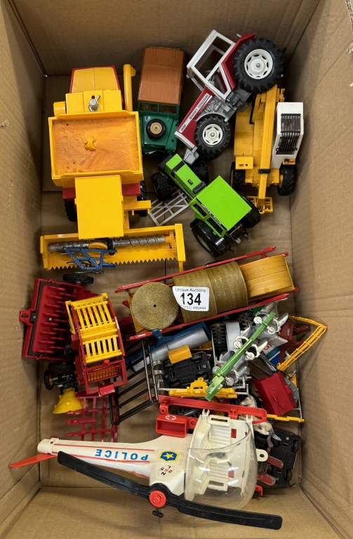 A quantity of Britains farm machinery including tractors, police helicopter etc