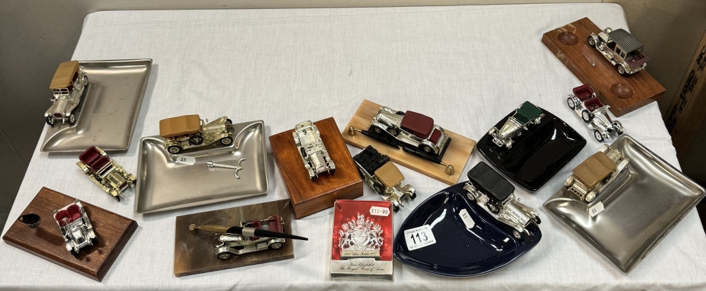 A quantity of Matchbox Yesteryear chrome plated presentation models on ashtrays, pen stands &