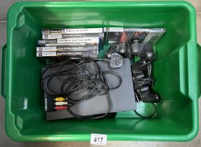 A Playstation 2 with 2 controllers & A quantity of games