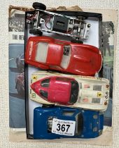 A quantity of vintage Cox slot cars including spare chassis