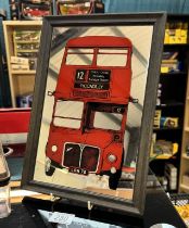 A vintage mirror picture of a Routemaster London bus