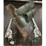 A pair of Vintage Lone Star Cheyenne Cowboy cap guns with holster belt