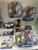A collection of new Star Wars items including figures, mugs in a box, backpacks & Avengers items