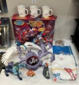 A boxed Disney Hercules Terrifying Hydra, A quantity of loose figures, Three new mugs & A new T-
