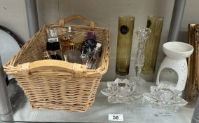 A basket of perfume bottles, mostly empty. 2 Lotus candleholders etc