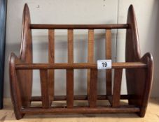A mahogany magazine rack