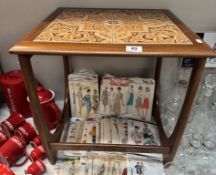 A vintage G Plan coffee table with tiled top