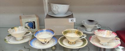 A quantity of Bavarian cups & saucers, A boxed smiling cup & saucer & A boxed Kingfisher mug