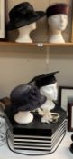 A large hat box & a quantity of hats including Mortas & Fascinator