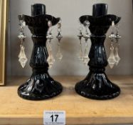 A pair of glass lustre candle sticks