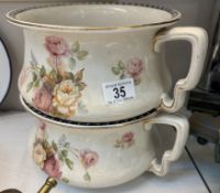 A matching pair of Edwardian rose pattern ceramic chamber pots / planters
