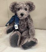 A grey bear with growler