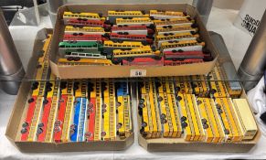 A large collection of plastic HO scale model buses