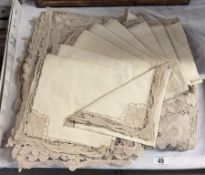 A handmade lace tablecloth, 8 matching placemats & 11 serviettes