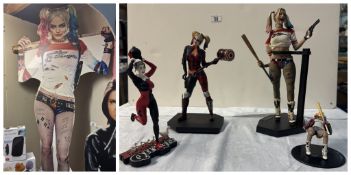 A Harley Quinn standee & 4 Harley Quinn figures