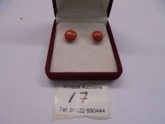 A pair of vintage natural coral stud earrings with gold posts (no backs).