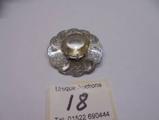 A Scottish chased silver brooch with centre quartz.