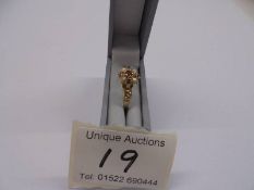 A 19thC ring set Amethyst, pearls and garnet in a cluster with openwork shoulders, tests as 15ct,