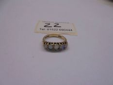 A five stone vintage opal ring set in 9ct gold, size L half, 2.79 grams