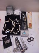 A mixed lot of necklaces, earings, watches etc.,
