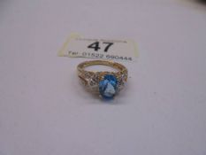 A 9ct gold vintage topaz and diamond ring, size O, 2.98 grams.