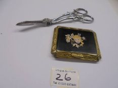 A Colibri compact in yellow metal with female profile on lid and white metal 19thC grape scissors.