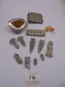 A circa 1970's reconstituted amber pendant in white metal, a yellow metal brooch.