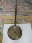 An engraved brass warming pan, COLLECT ONLY.