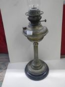A Victorian brass oil lamp.