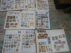Six albums of postage stamps.