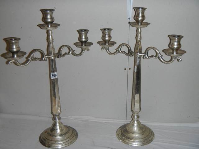 A pair of modern silver plate candelabra.