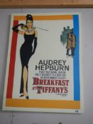 A Breakfast at Tiffany's poster featuring Audrey Hepburn.
