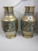A pair of Chinese vases with cloissonne style decoration.