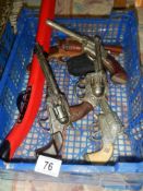 A quantity of vintage toy guns.